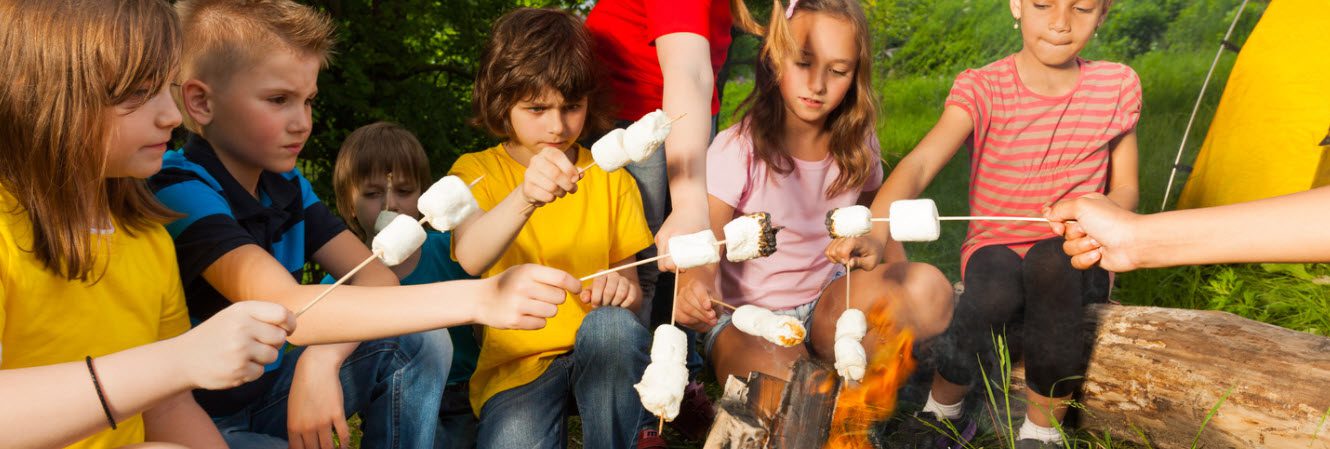 tips for camping with kids - kids with marshmallows