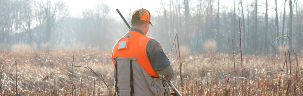 tips for hunting in summer - man in reeds