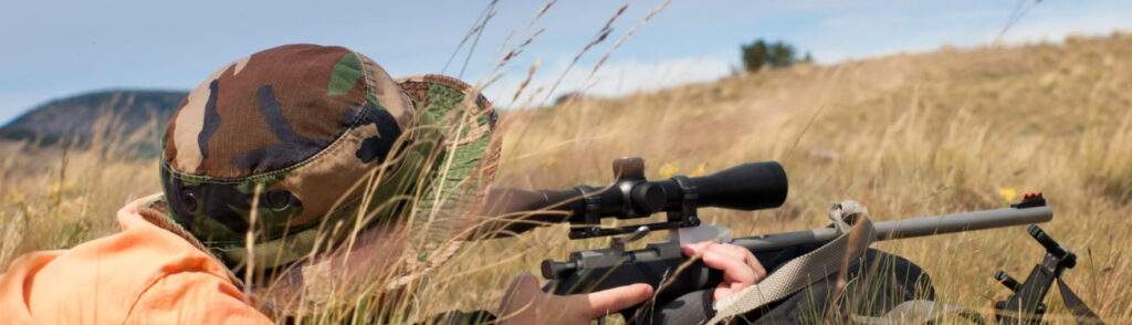 tips for hunting in summer - man shooting in summer