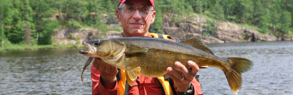 trolling rod and reel combo for walleye - man with walleye
