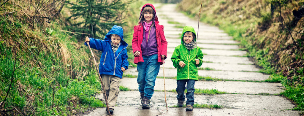 tips for camping in the rain - kids in rain gear
