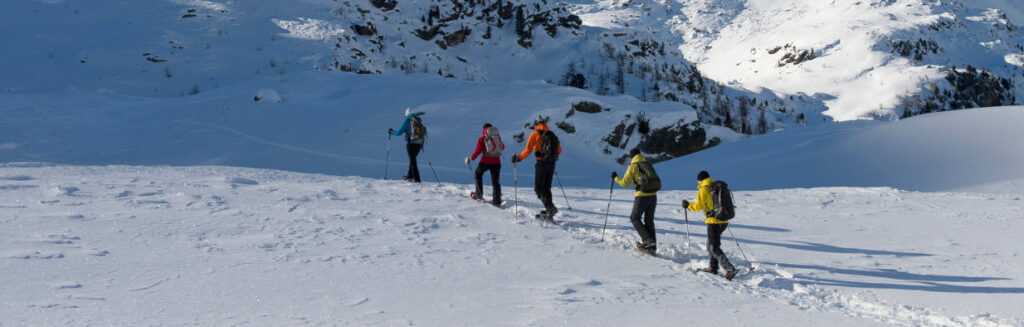 best snowshoes - group of people walking on snowshoes